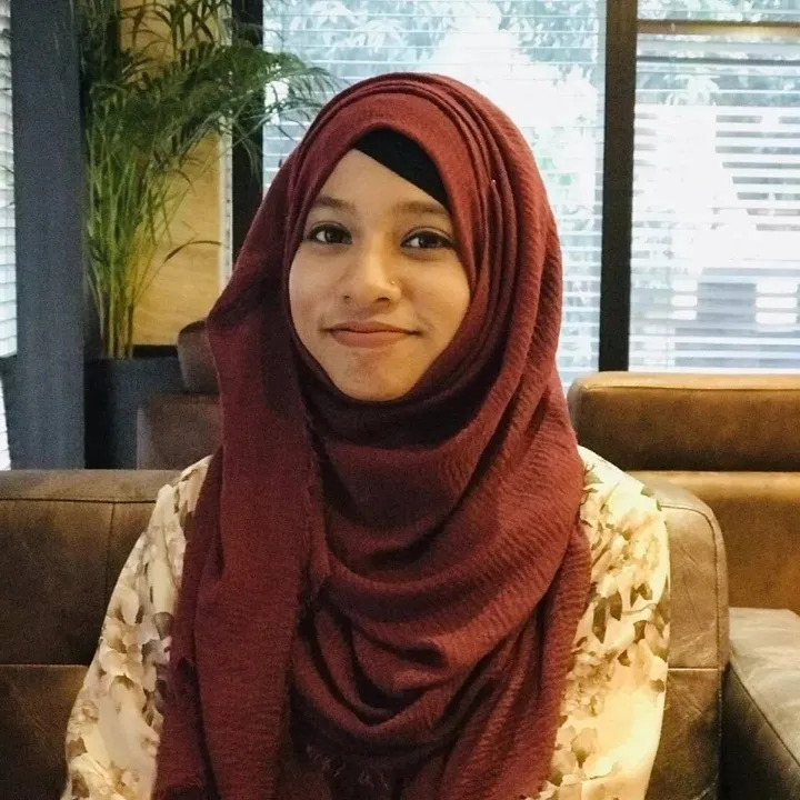 Ummay Habiba, founder and training consultant at SkillBridge Consultancy, smiling, wearing a maroon hijab